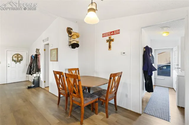a dining room with furniture and window