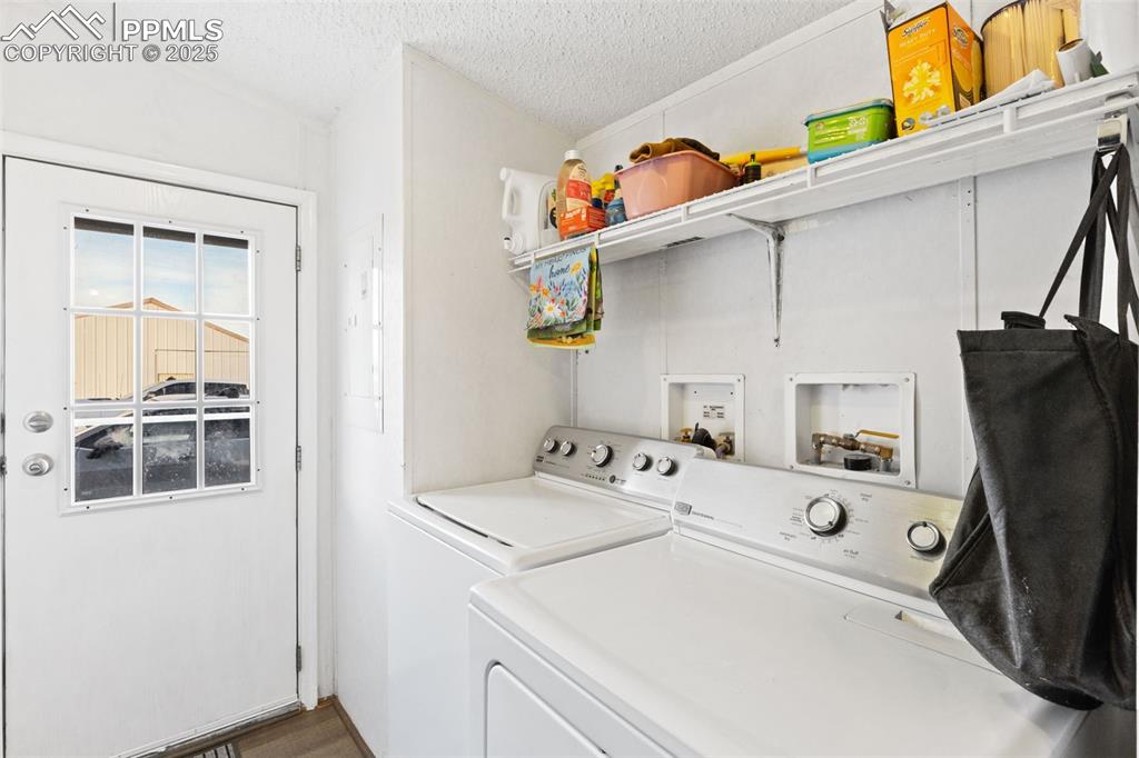 20480 Drennan Road Colorado Springs, CO 80928 - Photo 21 of 47 a utility room with dryer and washer
