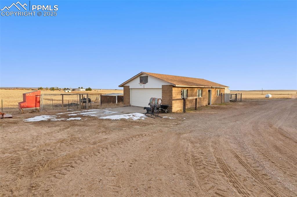 20480 Drennan Road Colorado Springs, CO 80928 - Photo 32 of 47 a view of an house with backyard and road