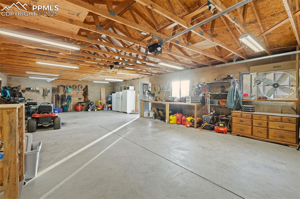 20480 Drennan Road Colorado Springs, CO 80928 - Photo 35 of 47 a view of a garage with storage and utility