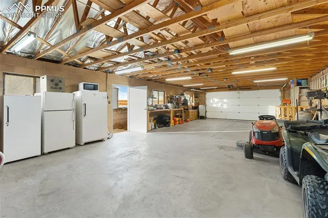 a view of a garage with parked cars