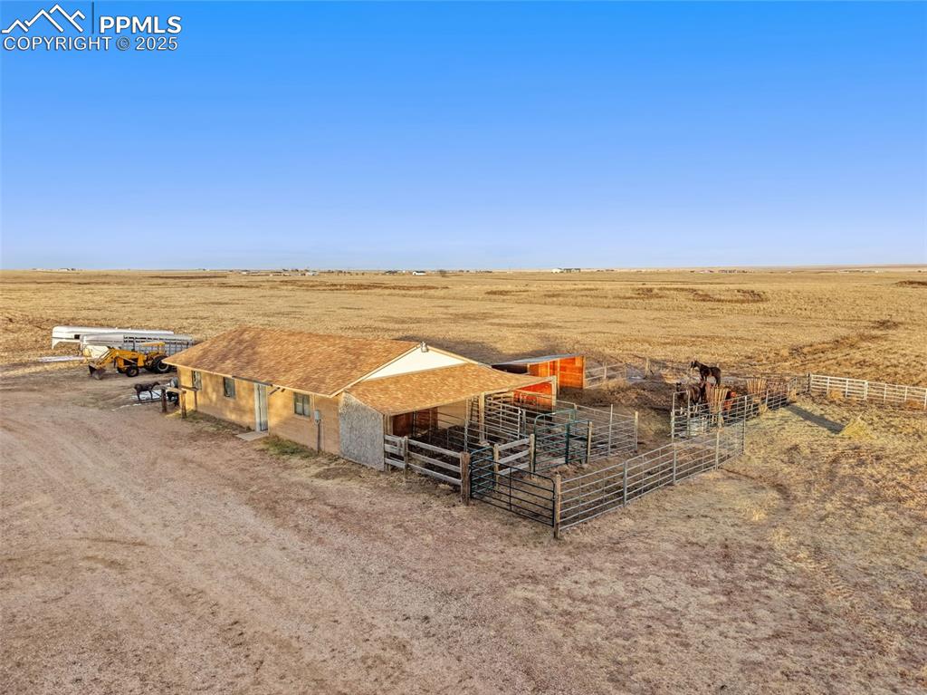 20480 Drennan Road Colorado Springs, CO 80928 - Photo 42 of 47 an ocean beach with an outdoor seating