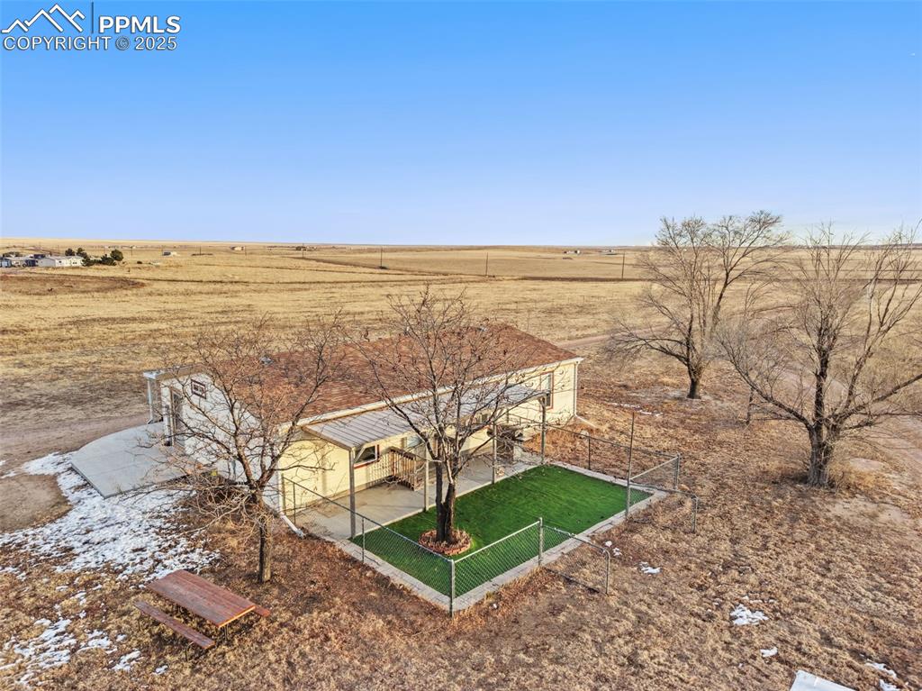 20480 Drennan Road Colorado Springs, CO 80928 - Photo 44 of 47 a view of a lake with a yard