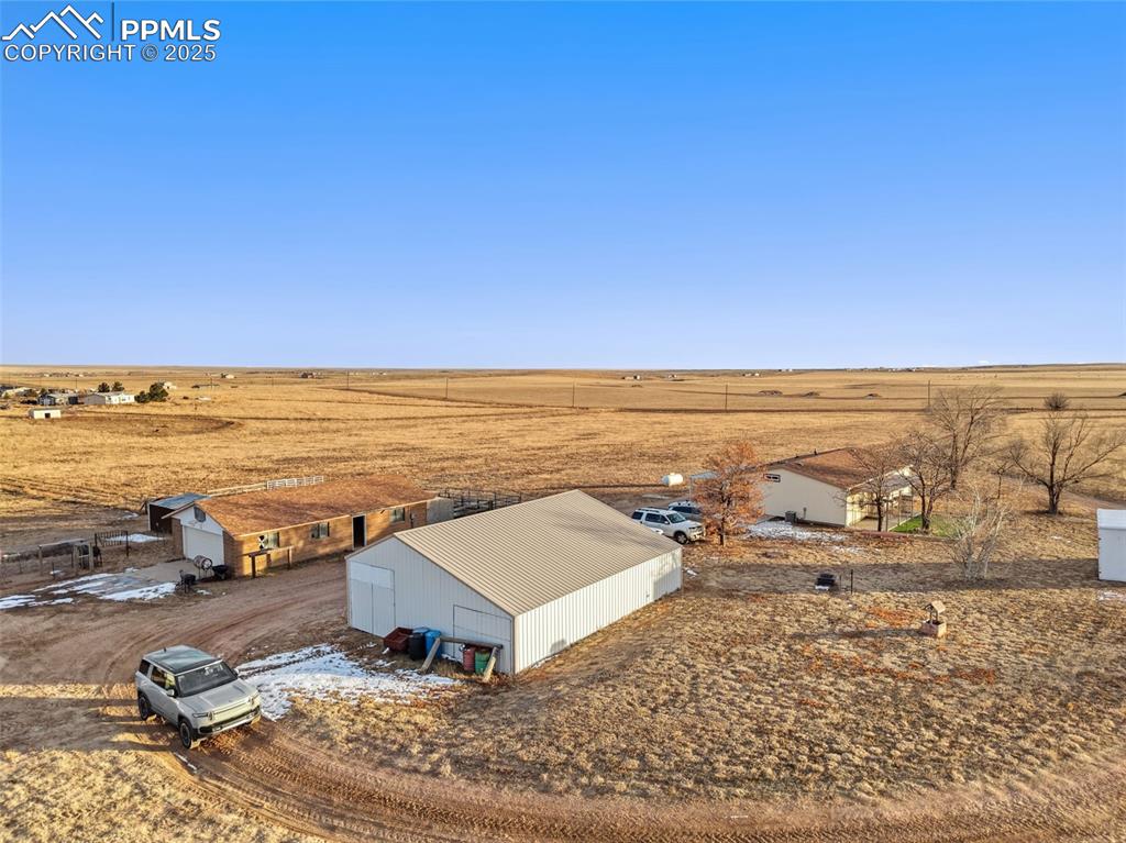 20480 Drennan Road Colorado Springs, CO 80928 - Photo 46 of 47 an ocean beach with residential house and ocean view