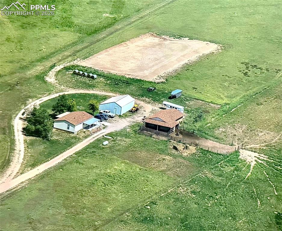20480 Drennan Road Colorado Springs, CO 80928 - Photo 6 of 47 a backyard of a house with table and chairs