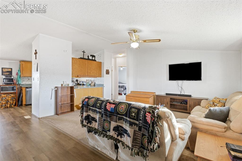 20480 Drennan Road Colorado Springs, CO 80928 - Photo 10 of 47 a living room with furniture and a flat screen tv