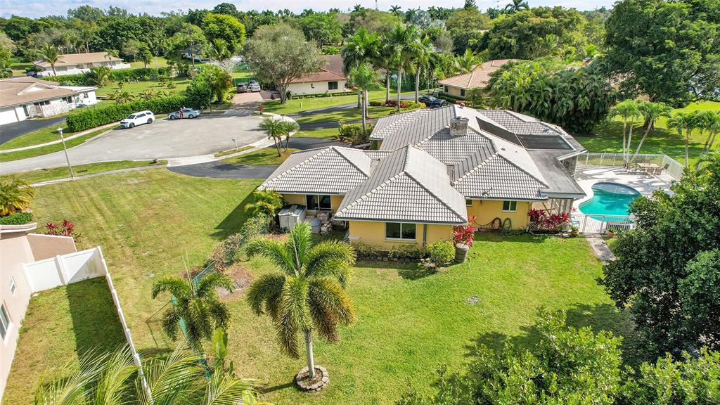 22299 Solitude Drive Boca Raton, FL 33428 - Photo 2 of 31 an aerial view of a house with swimming pool garden and patio