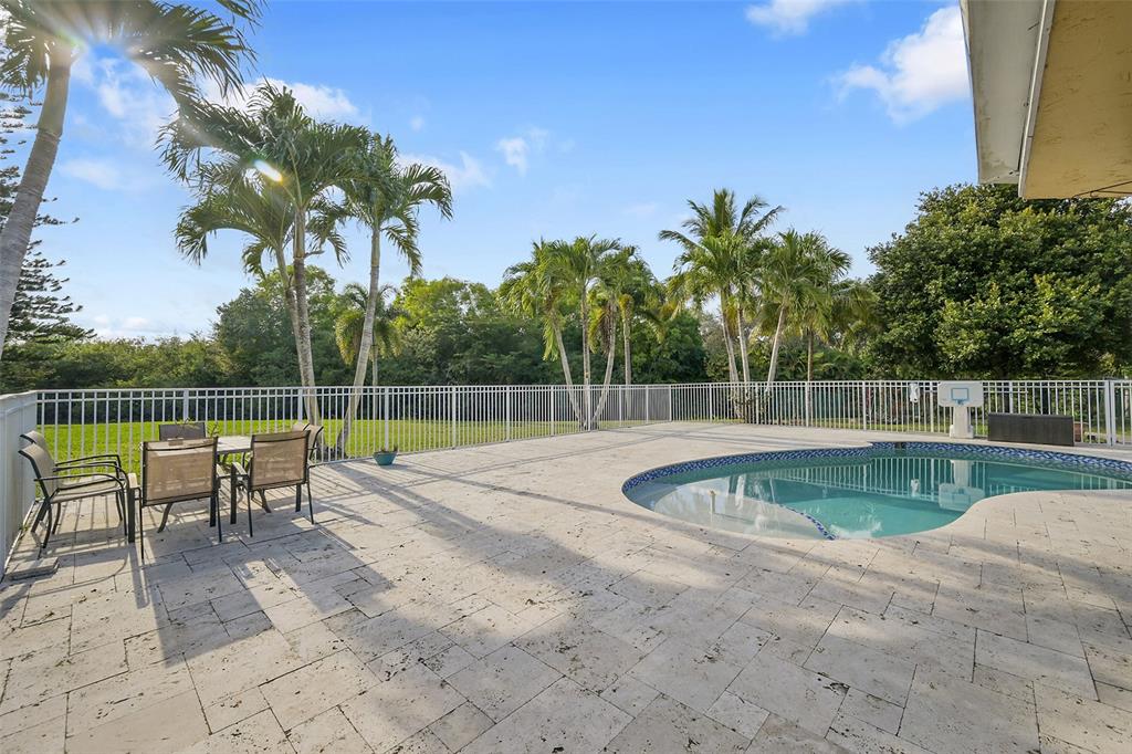 22299 Solitude Drive Boca Raton, FL 33428 - Photo 26 of 31 a view of a swimming pool with a lounge chair