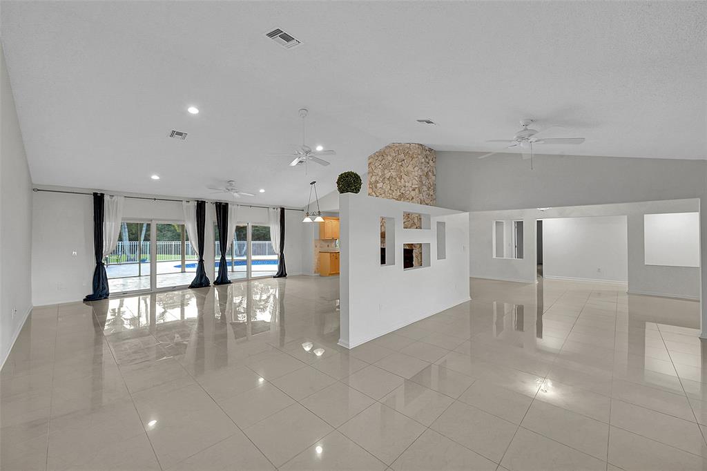 22299 Solitude Drive Boca Raton, FL 33428 - Photo 5 of 31 a view of a hallway with wooden floor
