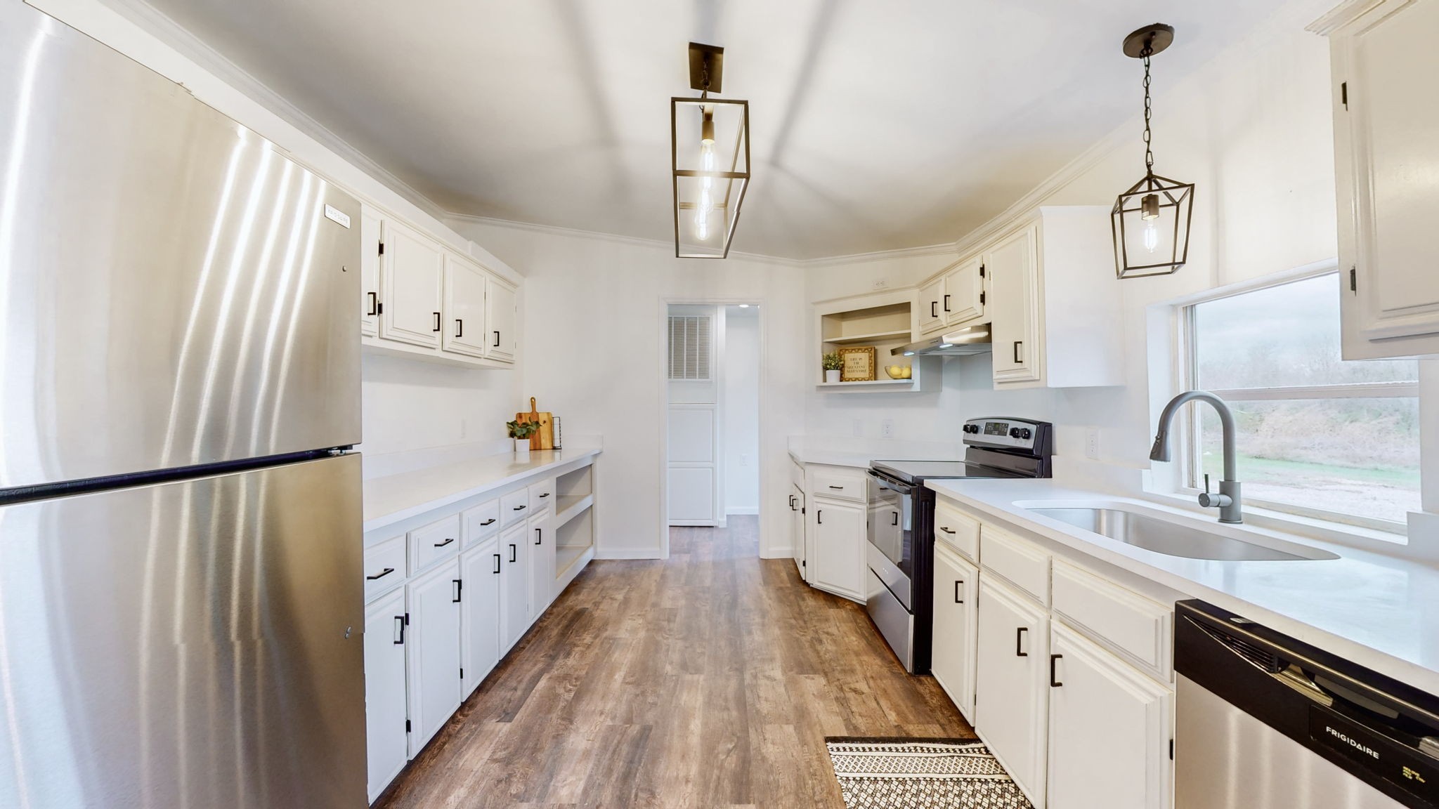 4452 William Woodard Road Springfield, TN 37172 - Photo 13 of 45 a kitchen with stainless steel appliances a stove a sink and a refrigerator