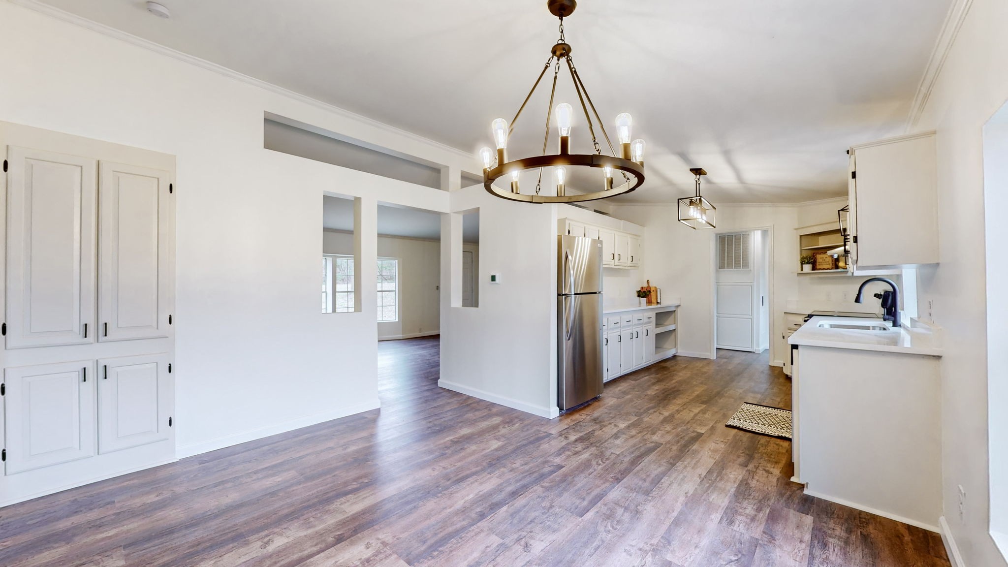 4452 William Woodard Road Springfield, TN 37172 - Photo 15 of 45 a view of a kitchen with a refrigerator and wooden floor
