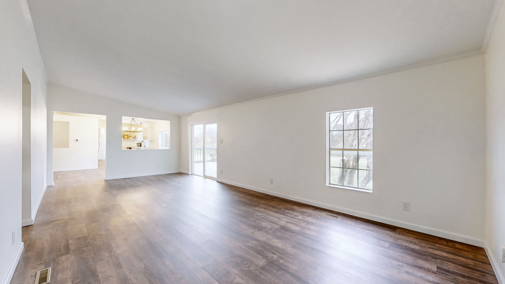 4452 William Woodard Road Springfield, TN 37172 - Photo 18 of 45 an empty room with wooden floor and windows