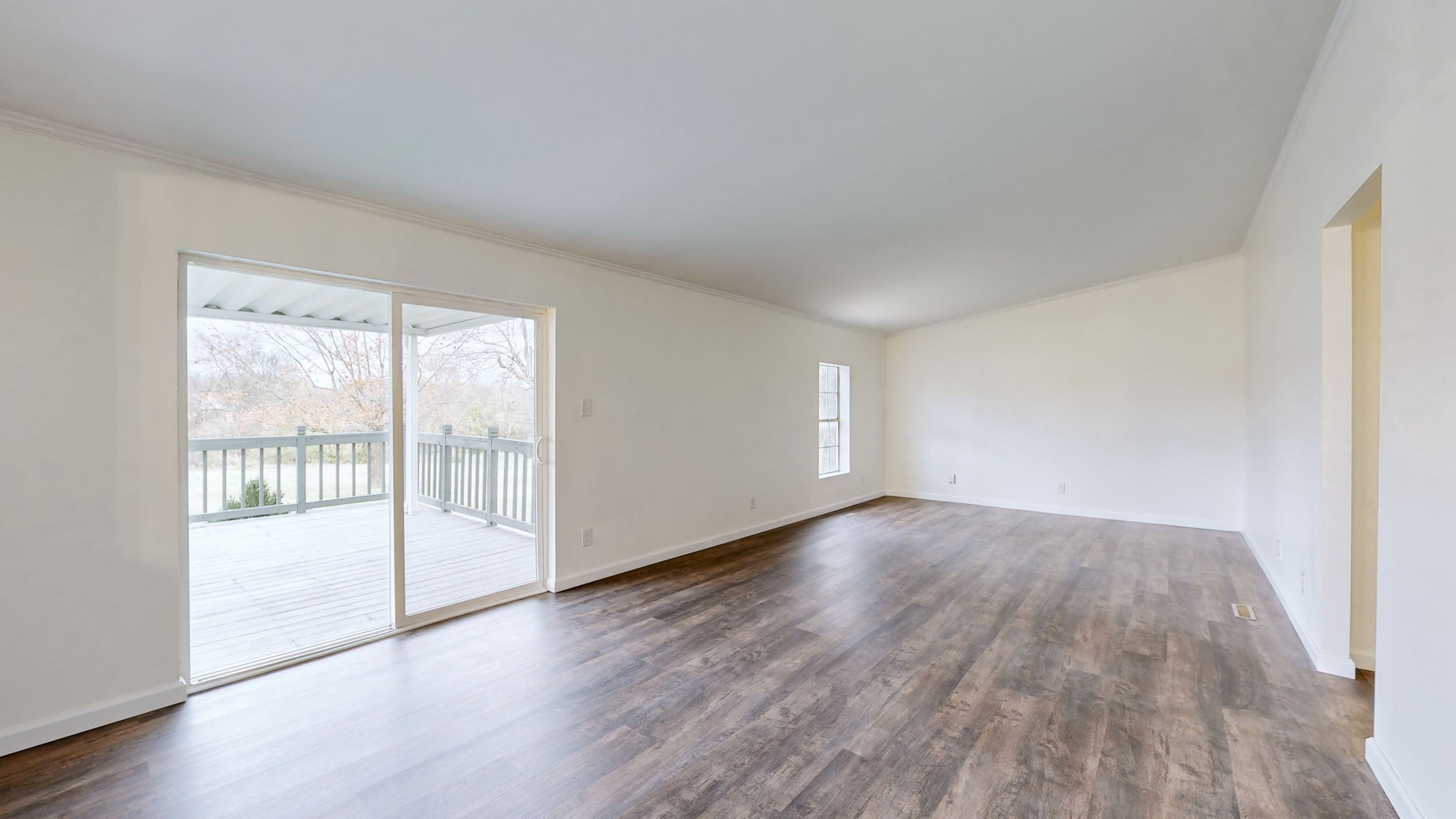 4452 William Woodard Road Springfield, TN 37172 - Photo 19 of 45 a view of an empty room with wooden floor and a window