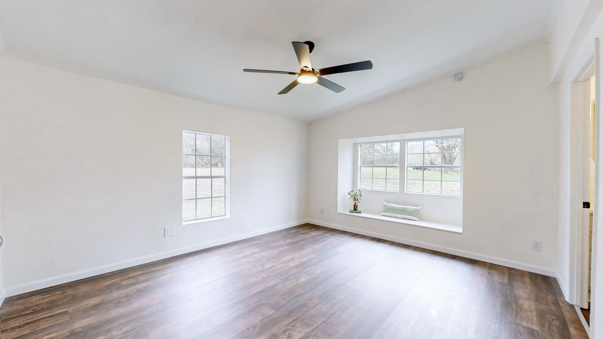 4452 William Woodard Road Springfield, TN 37172 - Photo 21 of 45 a view of empty room with wooden floor and fan