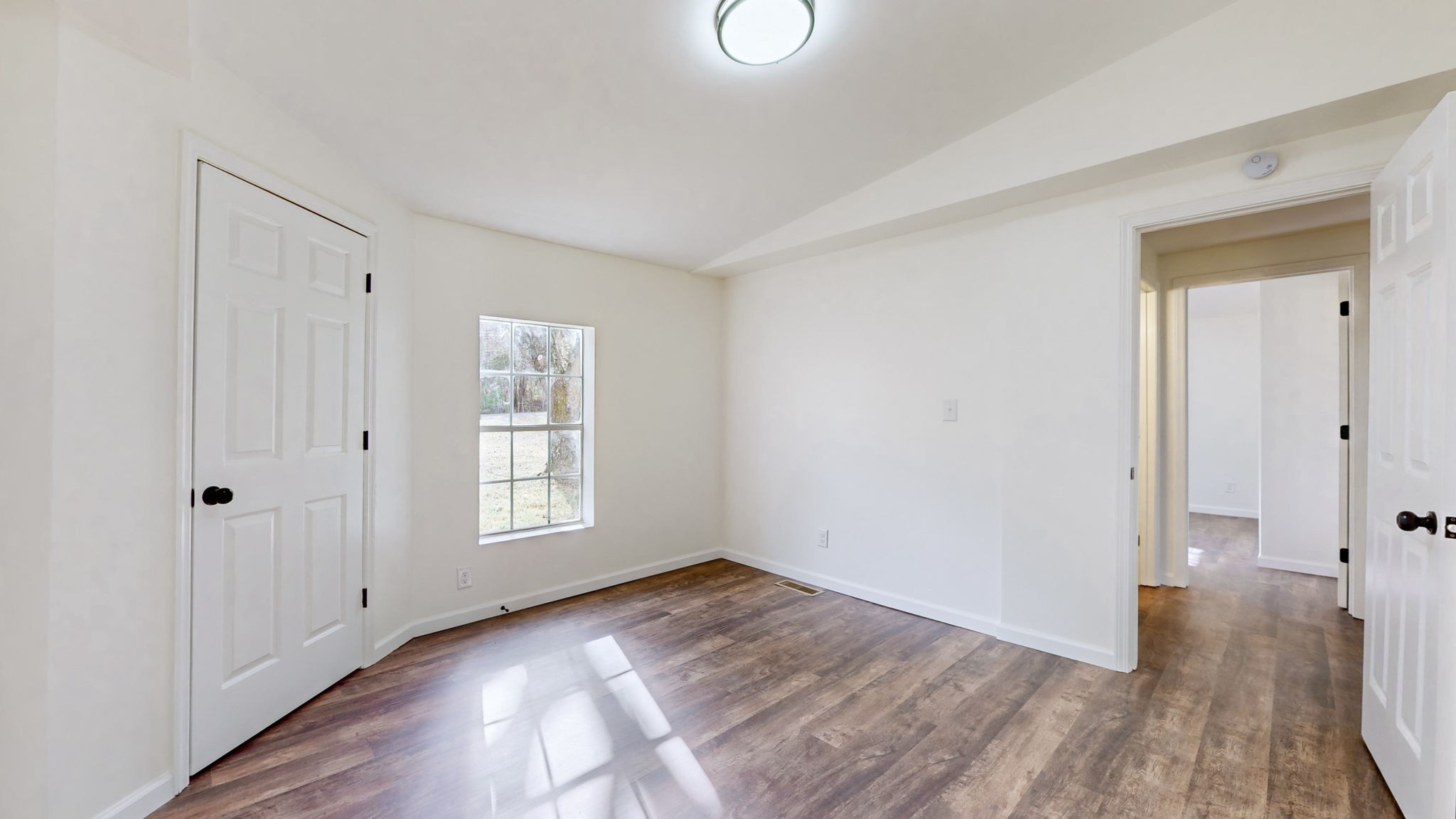 4452 William Woodard Road Springfield, TN 37172 - Photo 27 of 45 a view of an empty room with window and wooden floor