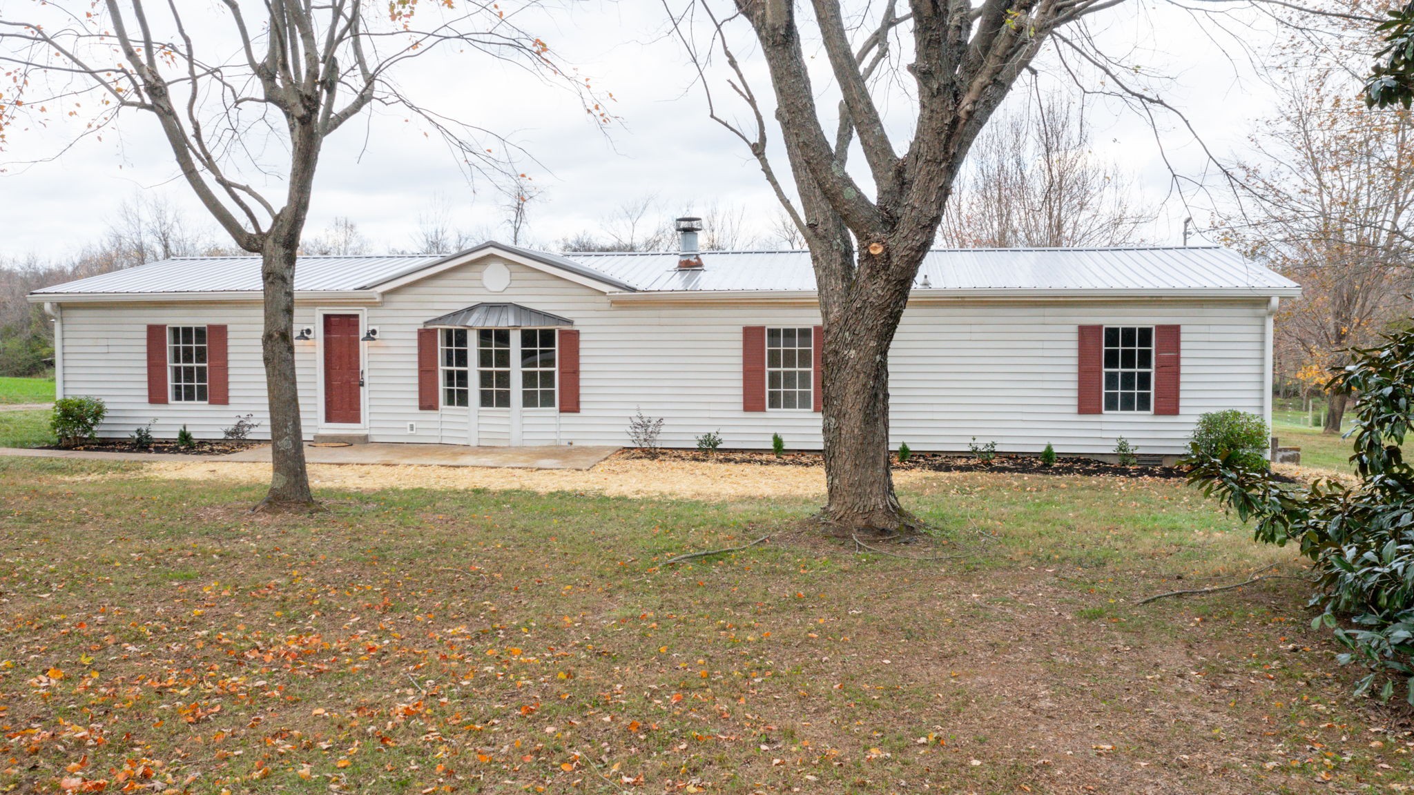4452 William Woodard Road Springfield, TN 37172 - Photo 3 of 45 a house with trees in the background