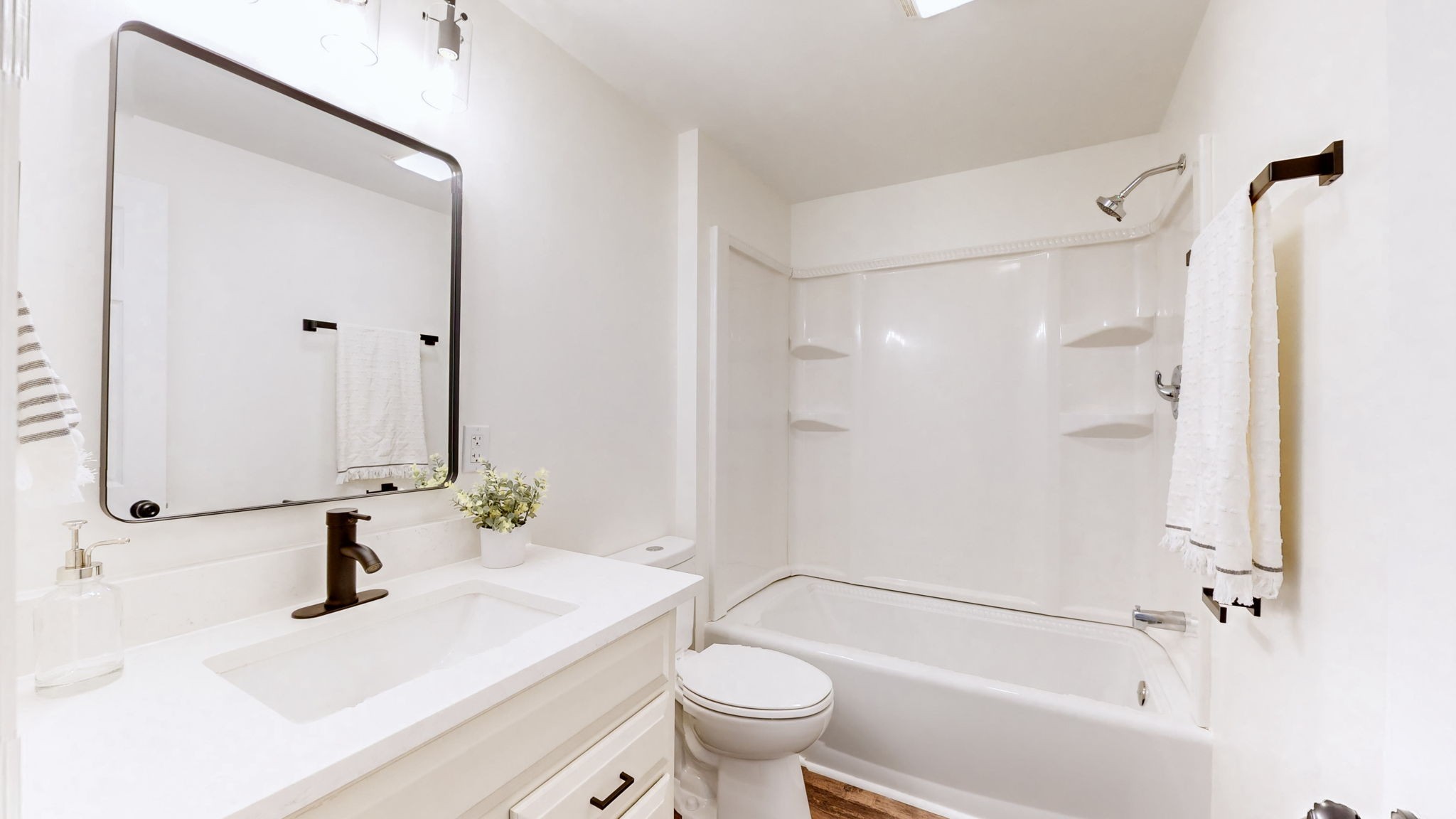 4452 William Woodard Road Springfield, TN 37172 - Photo 31 of 45 a bathroom with a bathtub shower sink vanity and toilet