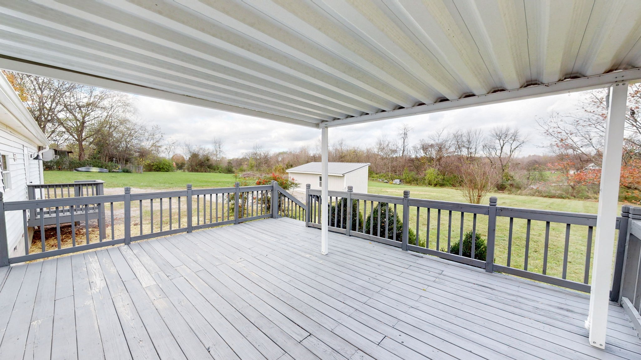 4452 William Woodard Road Springfield, TN 37172 - Photo 35 of 45 a view of a porch with wooden floor