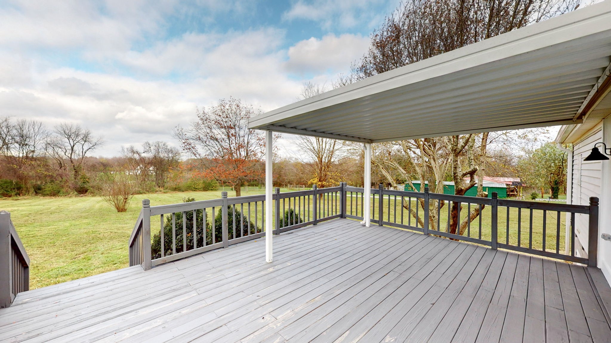 4452 William Woodard Road Springfield, TN 37172 - Photo 36 of 45 a balcony with wooden floor