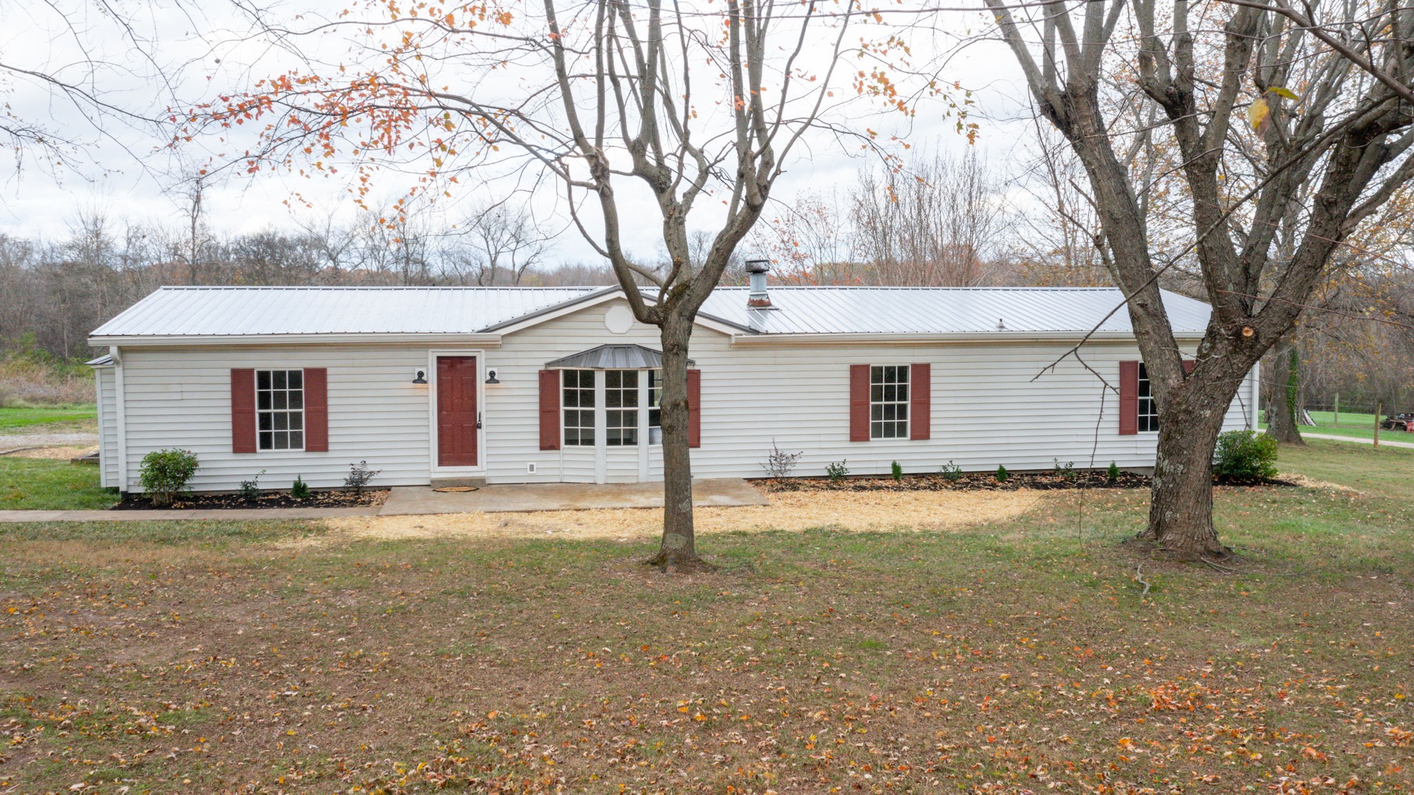4452 William Woodard Road Springfield, TN 37172 - Photo 4 of 45 a view of a yard in front of a house with large trees