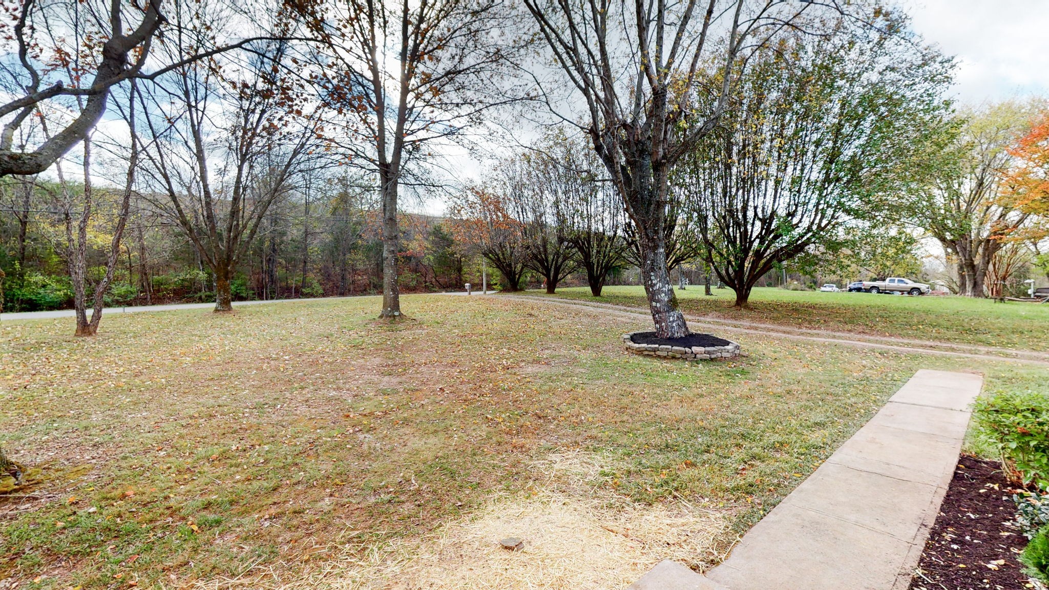 4452 William Woodard Road Springfield, TN 37172 - Photo 7 of 45 a swimming pool with trees in the background