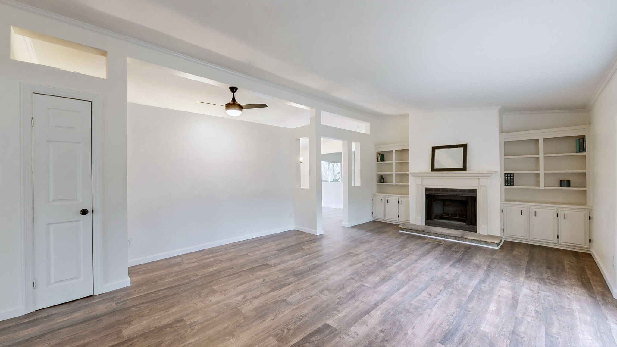 4452 William Woodard Road Springfield, TN 37172 - Photo 8 of 45 an empty room with windows and a fireplace