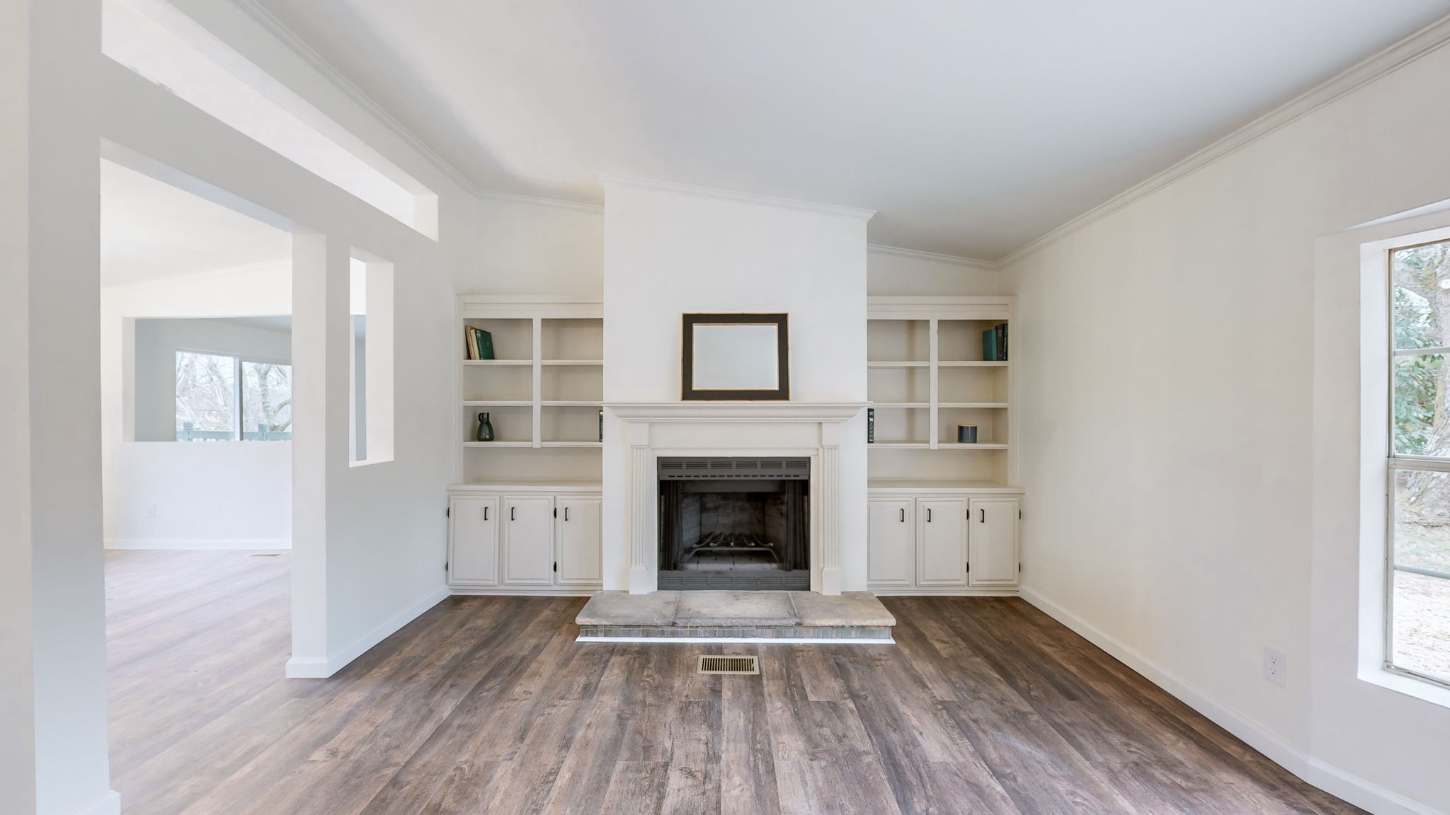 4452 William Woodard Road Springfield, TN 37172 - Photo 9 of 45 a view of a livingroom with wooden floor and a fireplace