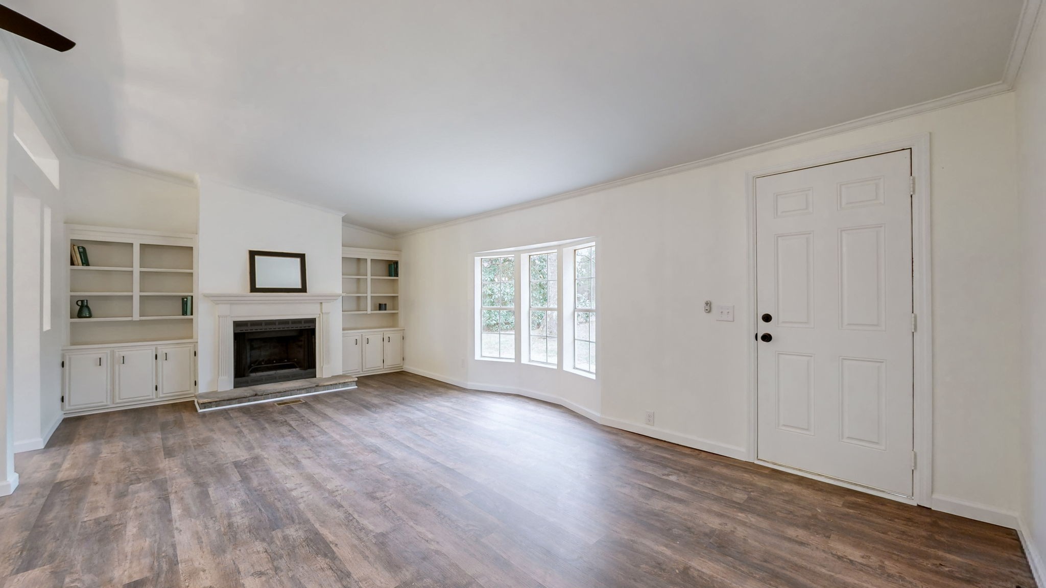 4452 William Woodard Road Springfield, TN 37172 - Photo 10 of 45 wooden floor fireplace and windows in an empty room