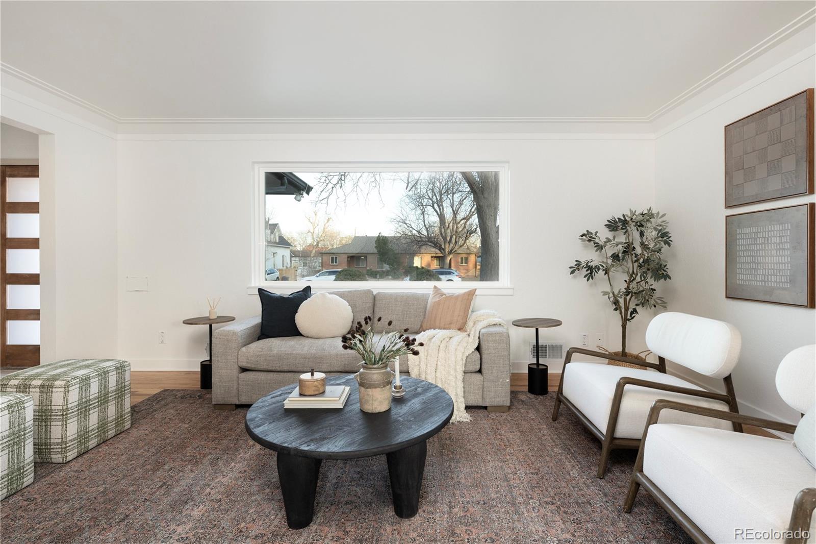 1617 Wolff Street Denver, CO 80204 - Photo 14 of 38 a living room with furniture and a large window