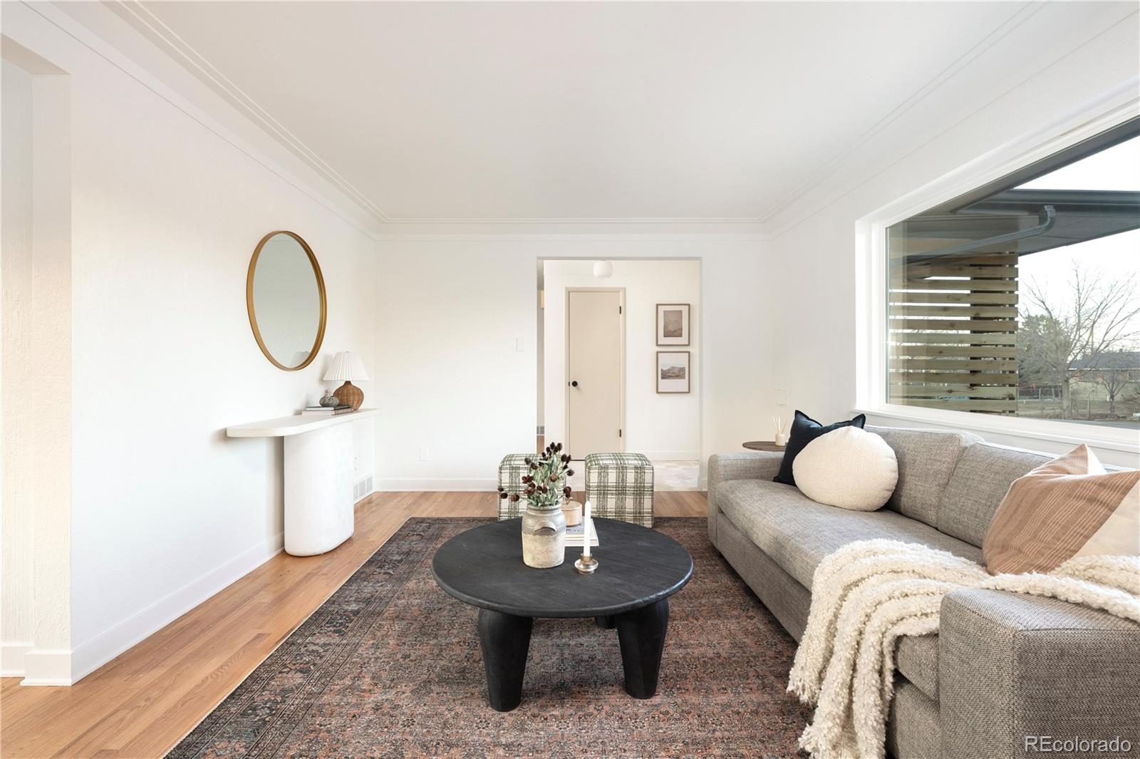 1617 Wolff Street Denver, CO 80204 - Photo 15 of 38 a living room with furniture a window and a table
