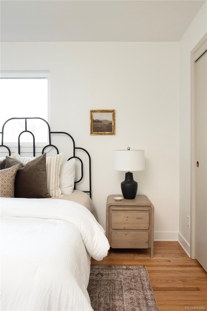 1617 Wolff Street Denver, CO 80204 - Photo 20 of 38 a bedroom with a bed and window