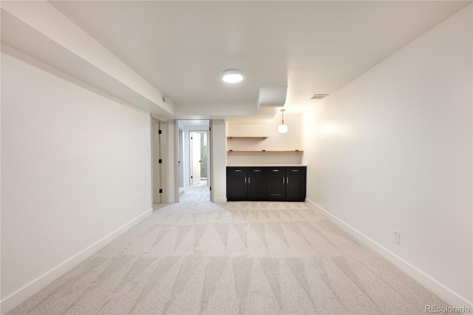 1617 Wolff Street Denver, CO 80204 - Photo 27 of 38 a view of empty room with a fireplace