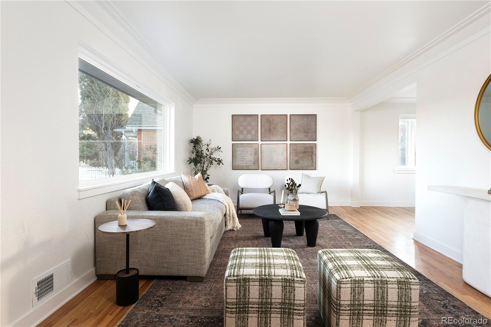 1617 Wolff Street Denver, CO 80204 - Photo 3 of 38 a living room with furniture and a window
