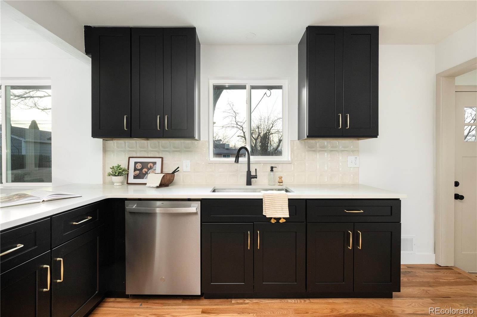1617 Wolff Street Denver, CO 80204 - Photo 6 of 38 a kitchen with a sink and cabinets