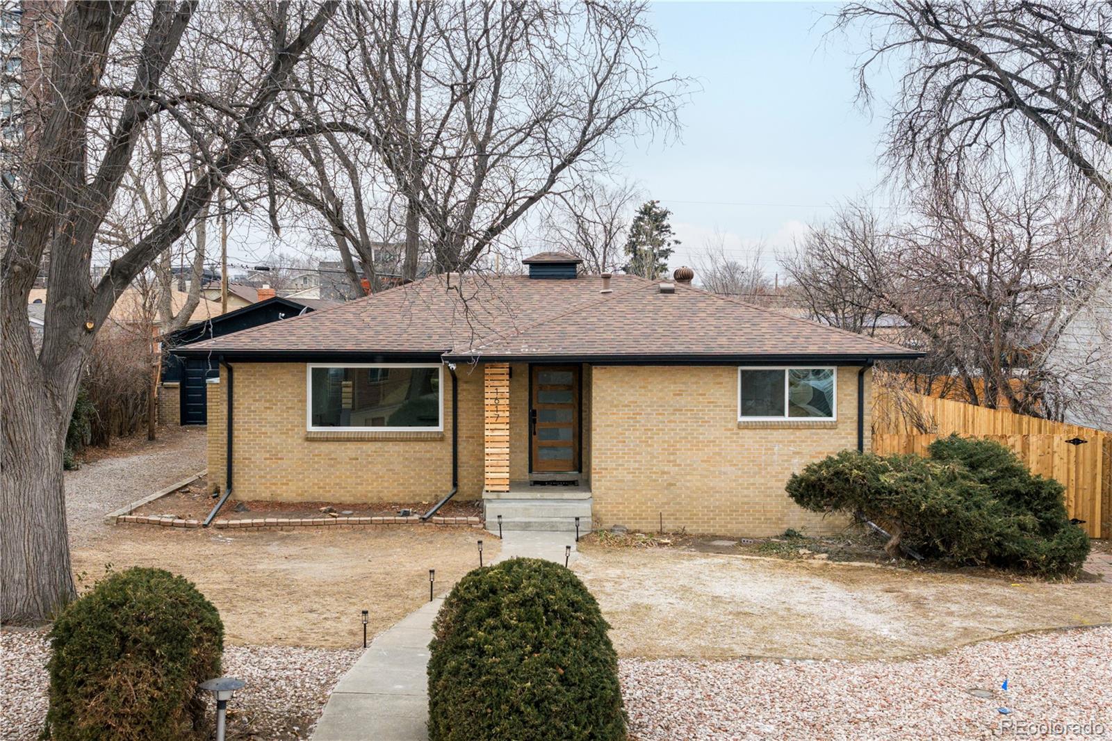 1617 Wolff Street Denver, CO 80204 - Photo 10 of 38 a house that has a tree in front of it