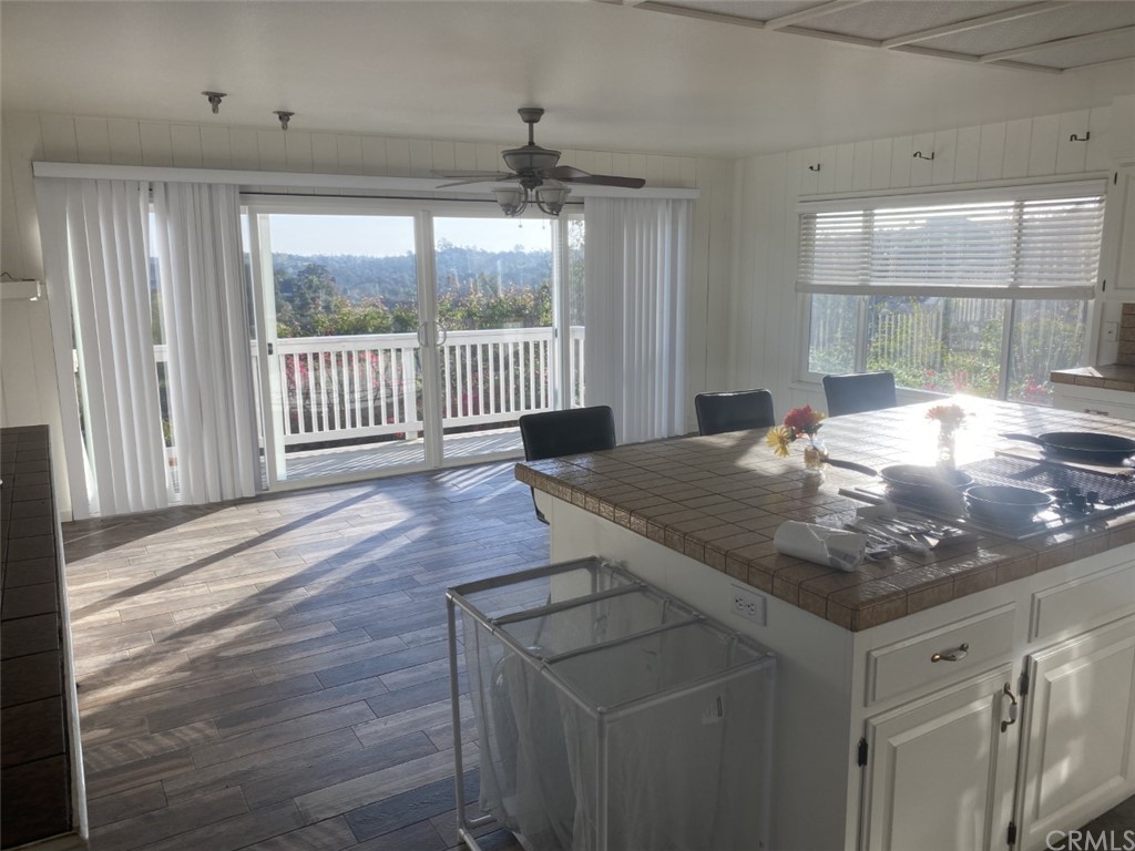 2710 Los Alisos Drive Fallbrook, CA 92028 - Photo 11 of 13 a kitchen with a table chairs and a window