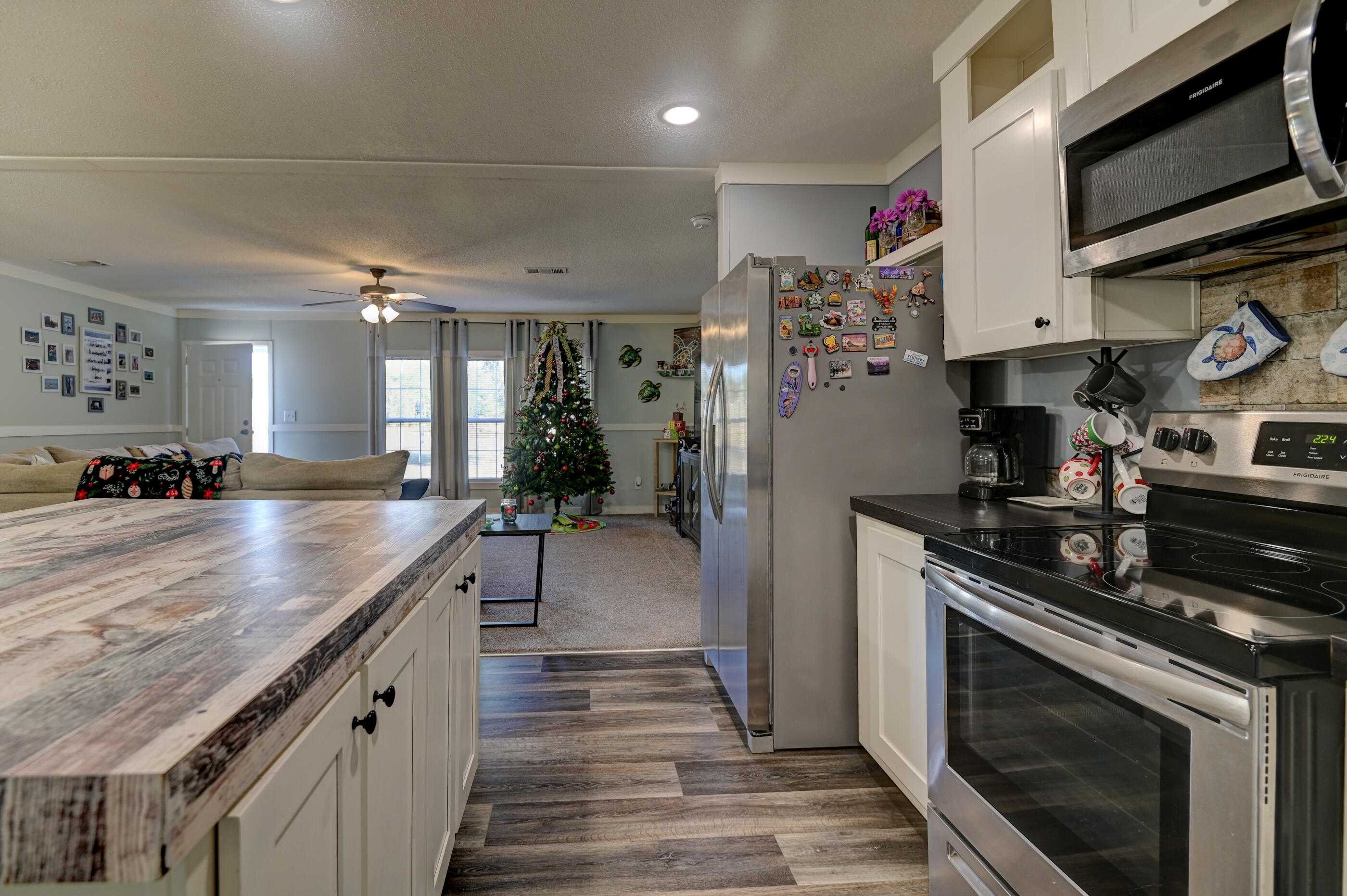 5256 Mt Olive Road Crestview, FL 32539 - Photo 13 of 68 a kitchen with stainless steel appliances granite countertop a stove a sink and a microwave
