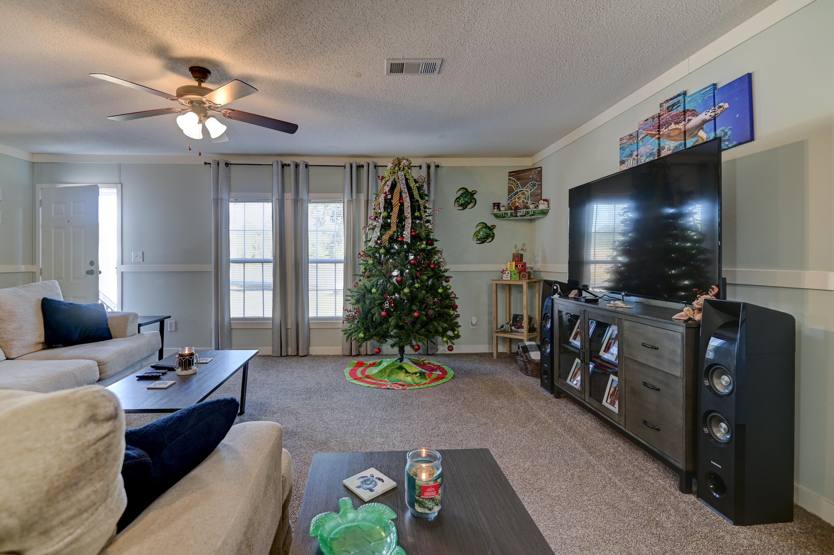 5256 Mt Olive Road Crestview, FL 32539 - Photo 18 of 68 a living room with furniture and a flat screen tv