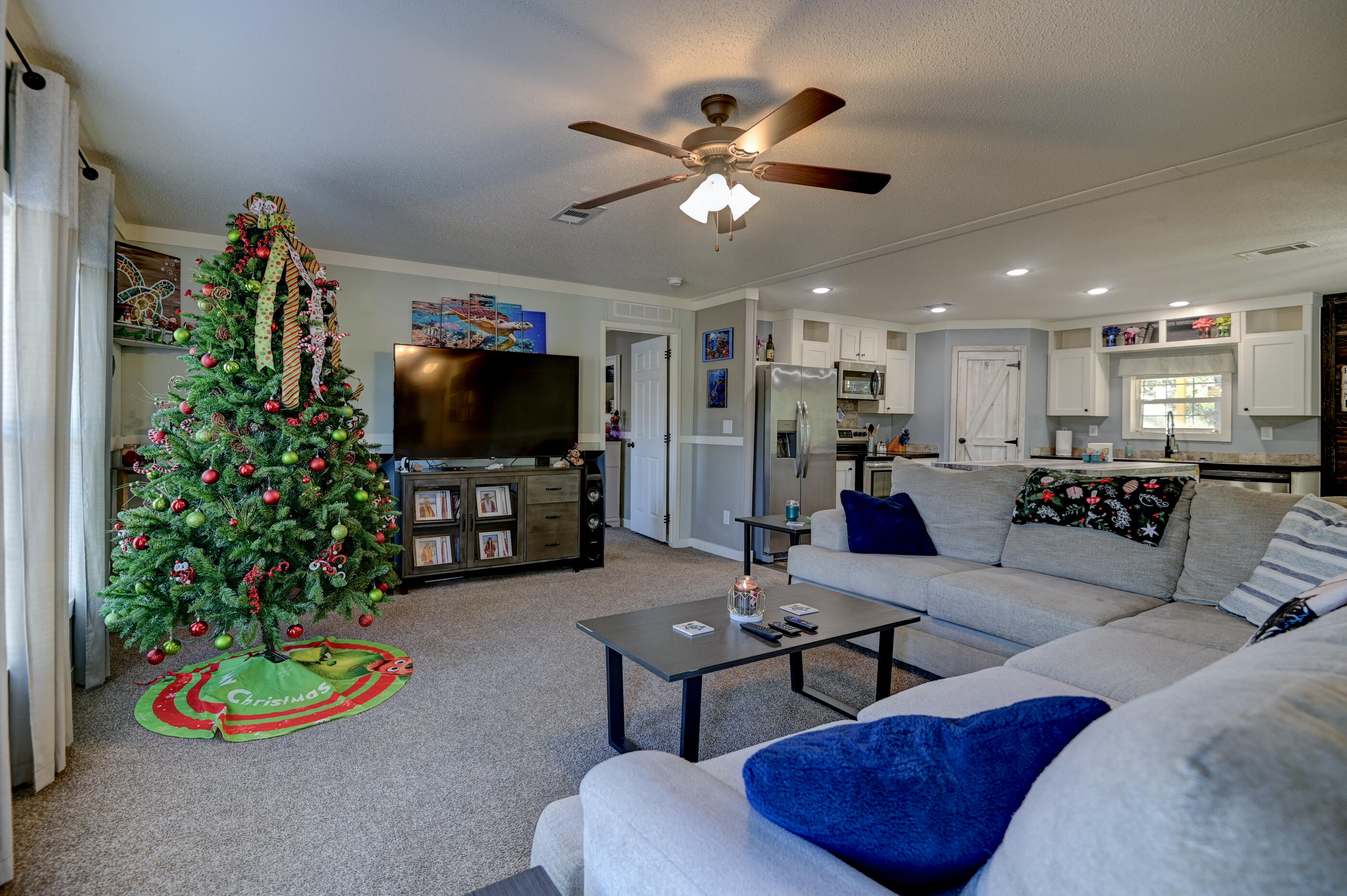 5256 Mt Olive Road Crestview, FL 32539 - Photo 21 of 68 a living room with furniture and a flat screen tv