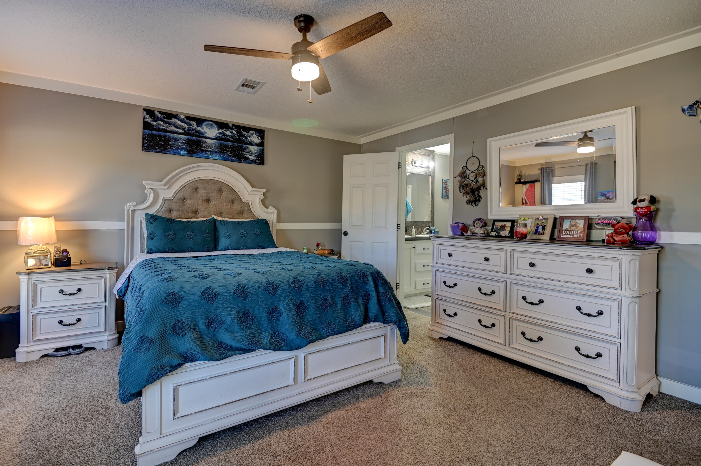 5256 Mt Olive Road Crestview, FL 32539 - Photo 28 of 68 a bedroom with a bed and a dresser