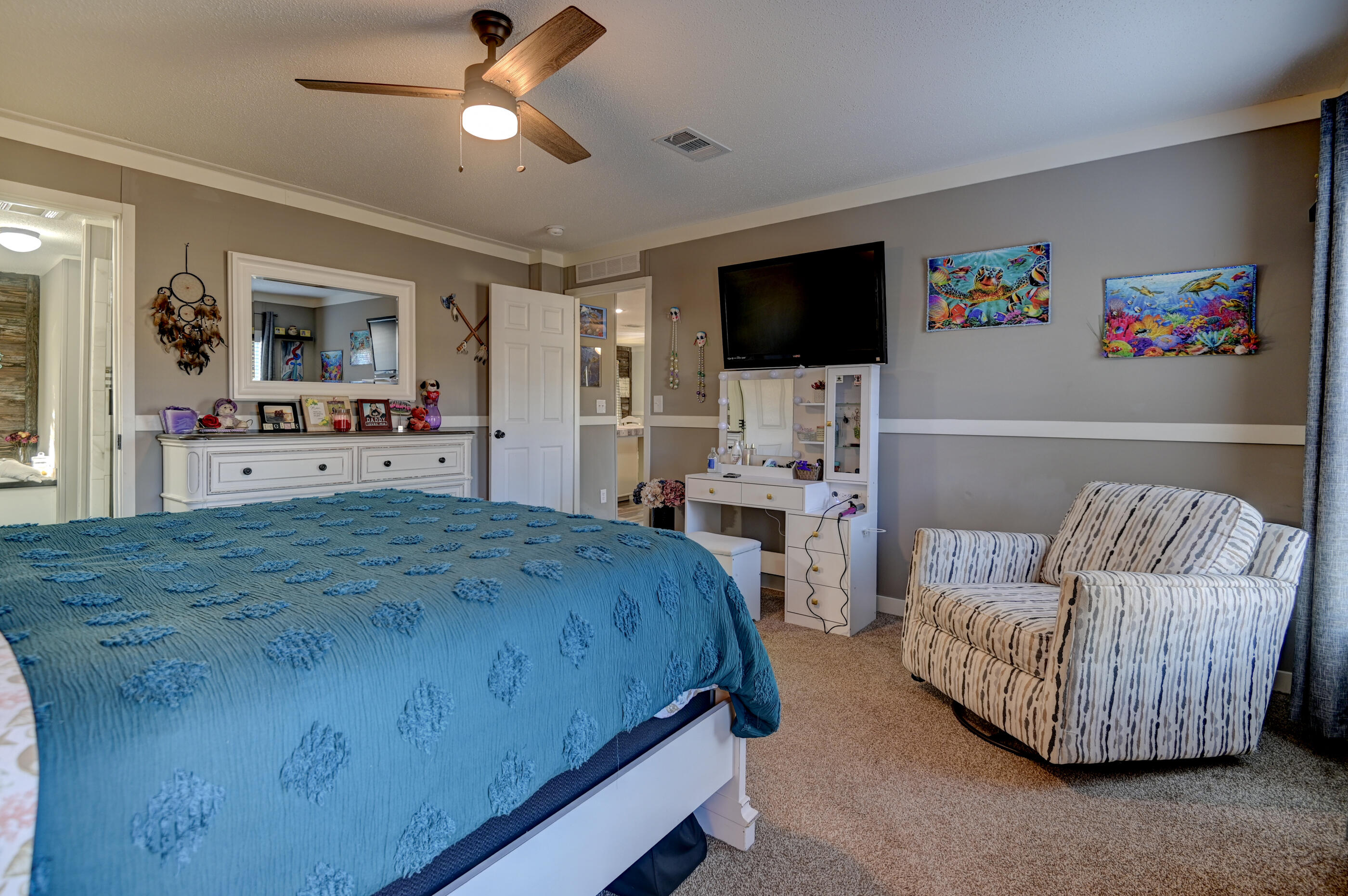 5256 Mt Olive Road Crestview, FL 32539 - Photo 30 of 68 a bedroom with bed and a flat screen tv