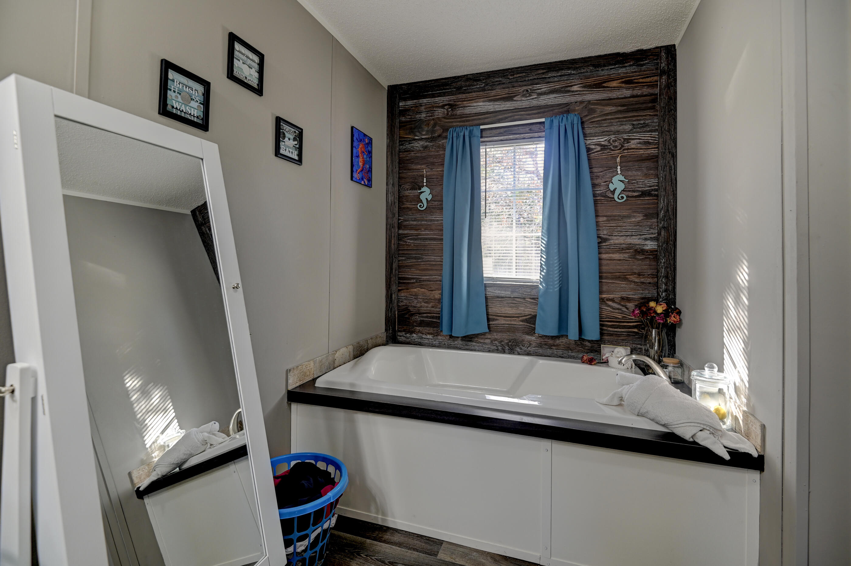 5256 Mt Olive Road Crestview, FL 32539 - Photo 32 of 68 a bathroom with a sink and a mirror