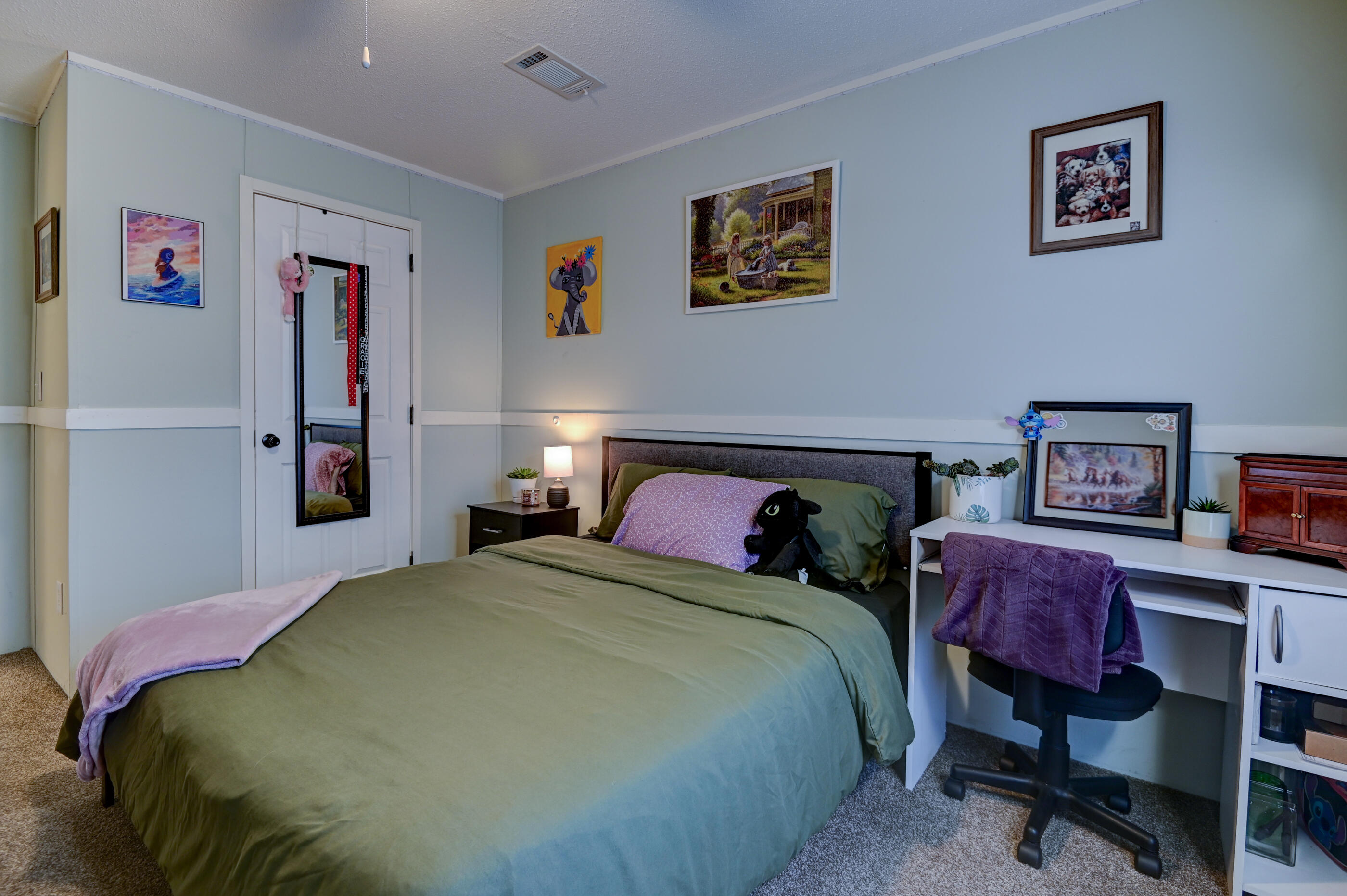 5256 Mt Olive Road Crestview, FL 32539 - Photo 39 of 68 a bedroom with a bed and a painting on the wall