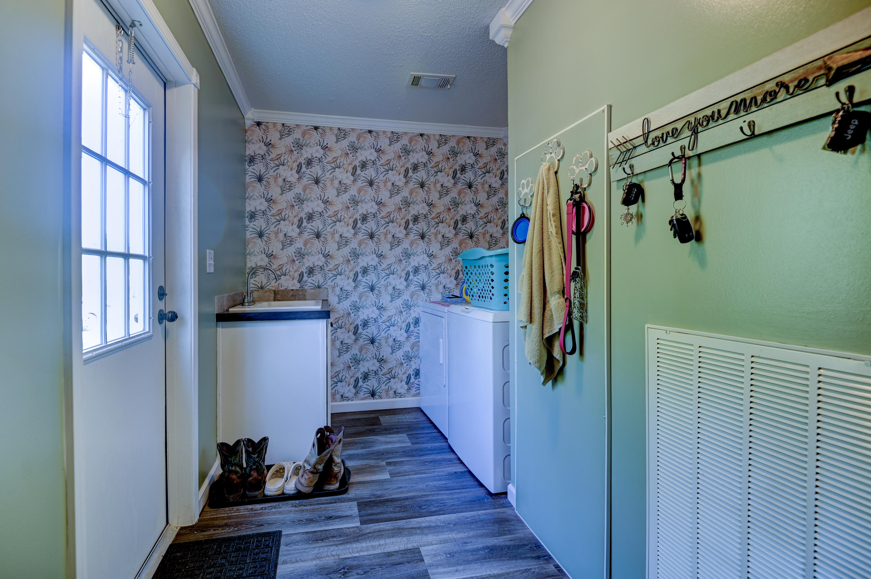 5256 Mt Olive Road Crestview, FL 32539 - Photo 46 of 68 a view of walk in closet with clothes and shoes