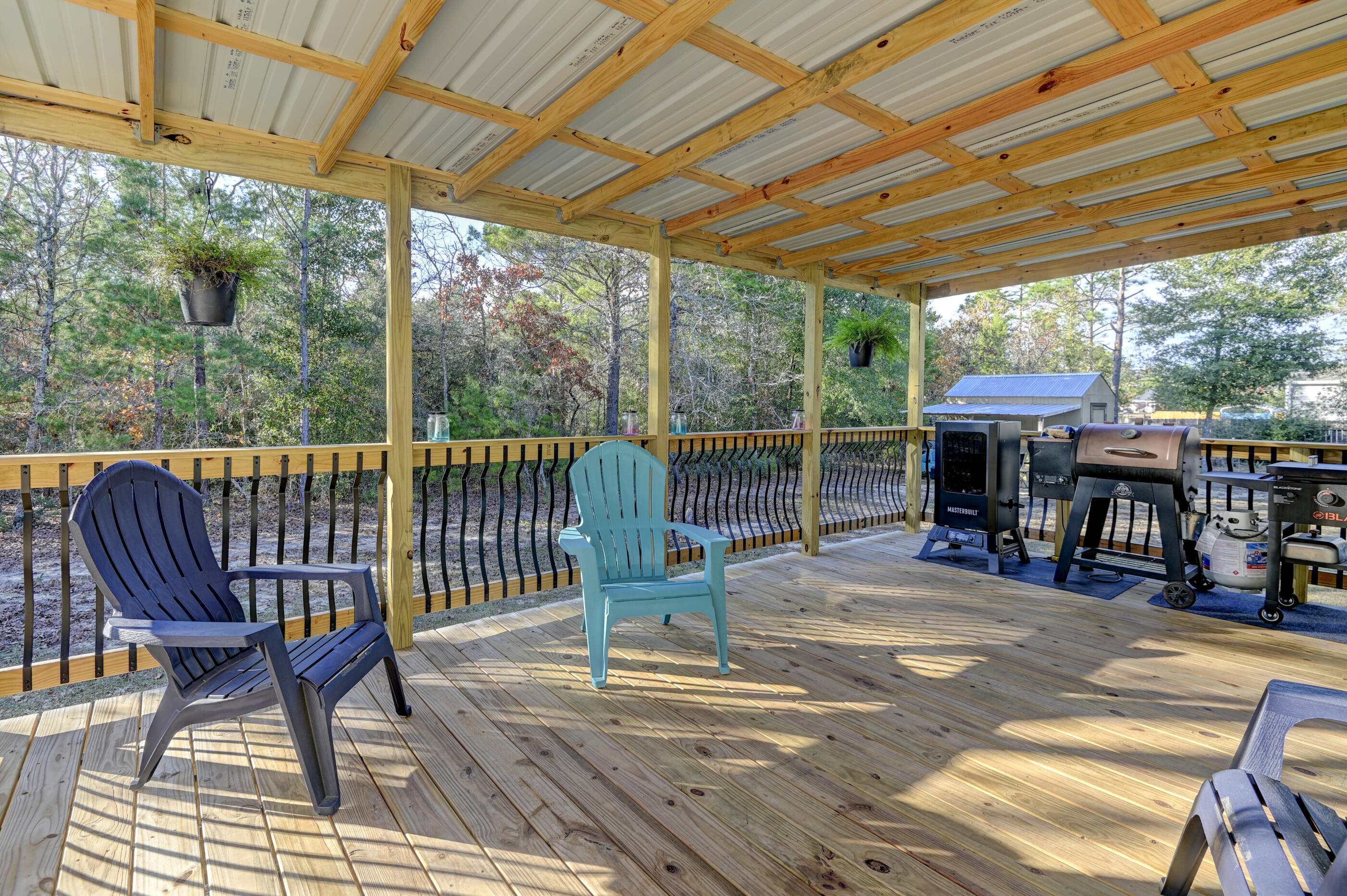 5256 Mt Olive Road Crestview, FL 32539 - Photo 50 of 68 a view of a patio with a table chairs and a patio