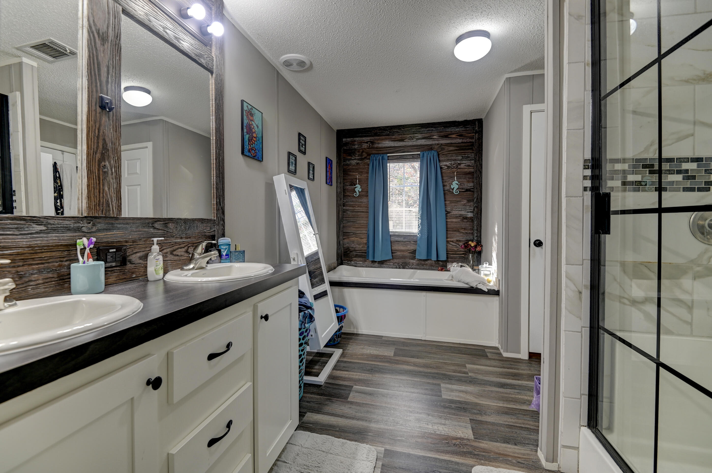 5256 Mt Olive Road Crestview, FL 32539 - Photo 5 of 68 a bathroom with a double vanity sink and a mirror