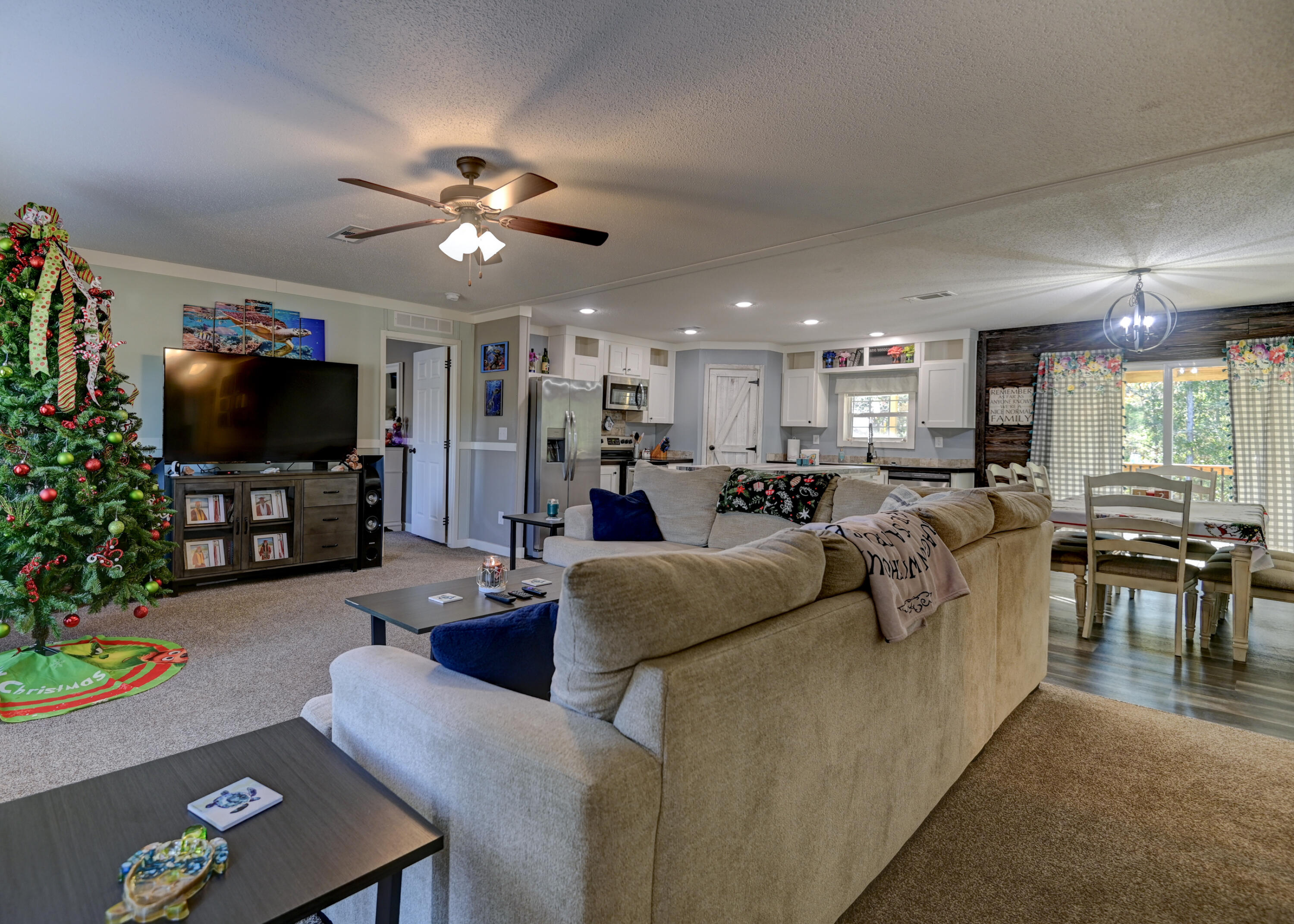 5256 Mt Olive Road Crestview, FL 32539 - Photo 6 of 68 a living room with furniture and a flat screen tv