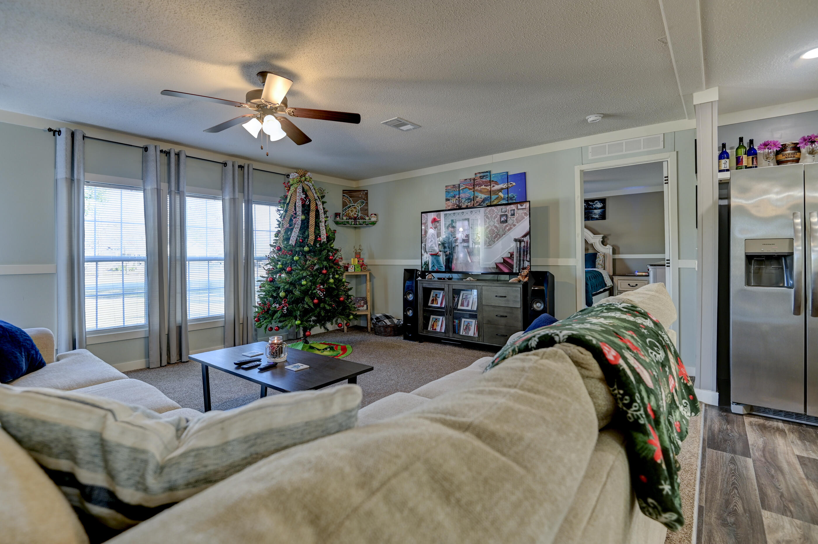 5256 Mt Olive Road Crestview, FL 32539 - Photo 9 of 68 a living room with furniture and a flat screen tv