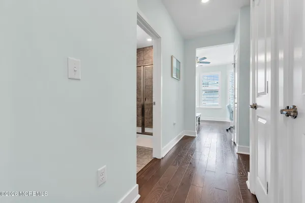 a dining table with chairs and kitchen view