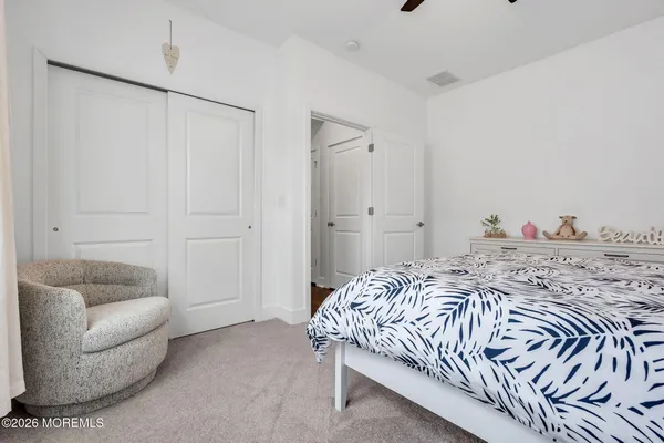 a view of a white house with a patio